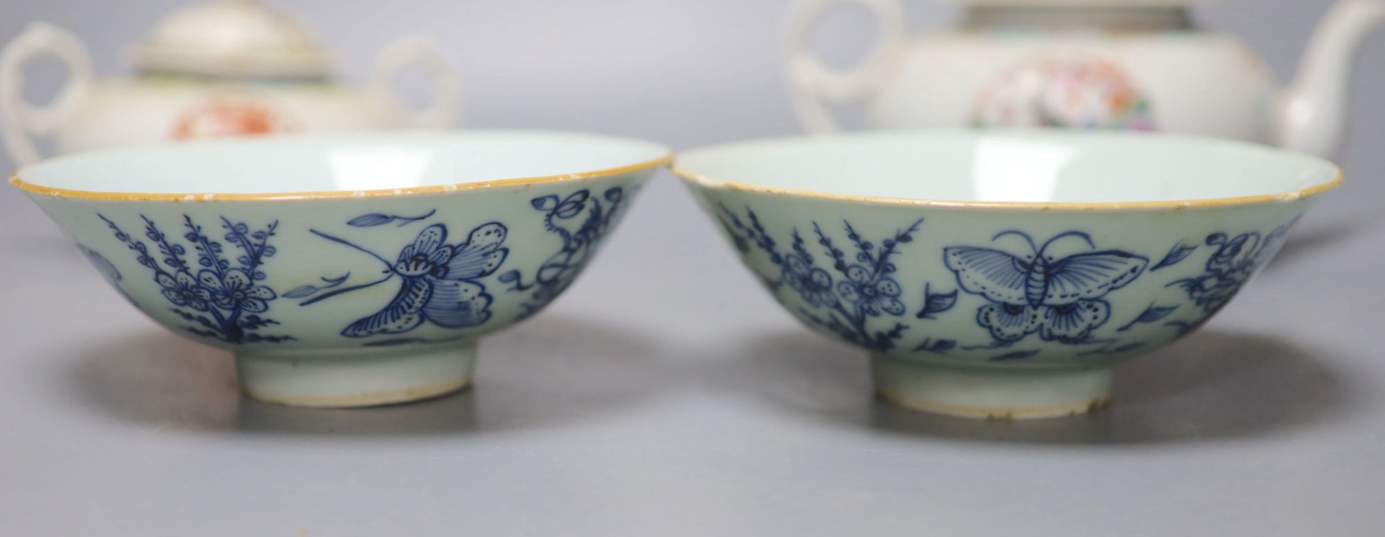 A Chinese famille rose teapot and sucrier, a 19th century Chinese bowl and a pair of blue and white bowls